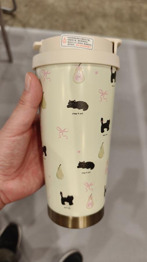 Hand-held view of TI-1158 500ml thermos sample with carry strap