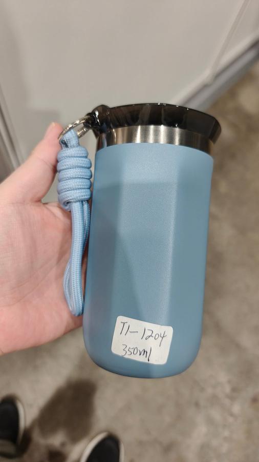 TI-1204 350ml haze-blue vacuum cup with braided carry strap at MEGA SHOW 2026