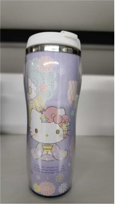 Hello Kitty insert-paper bottle — full-wrap artwork behind a clear outer wall