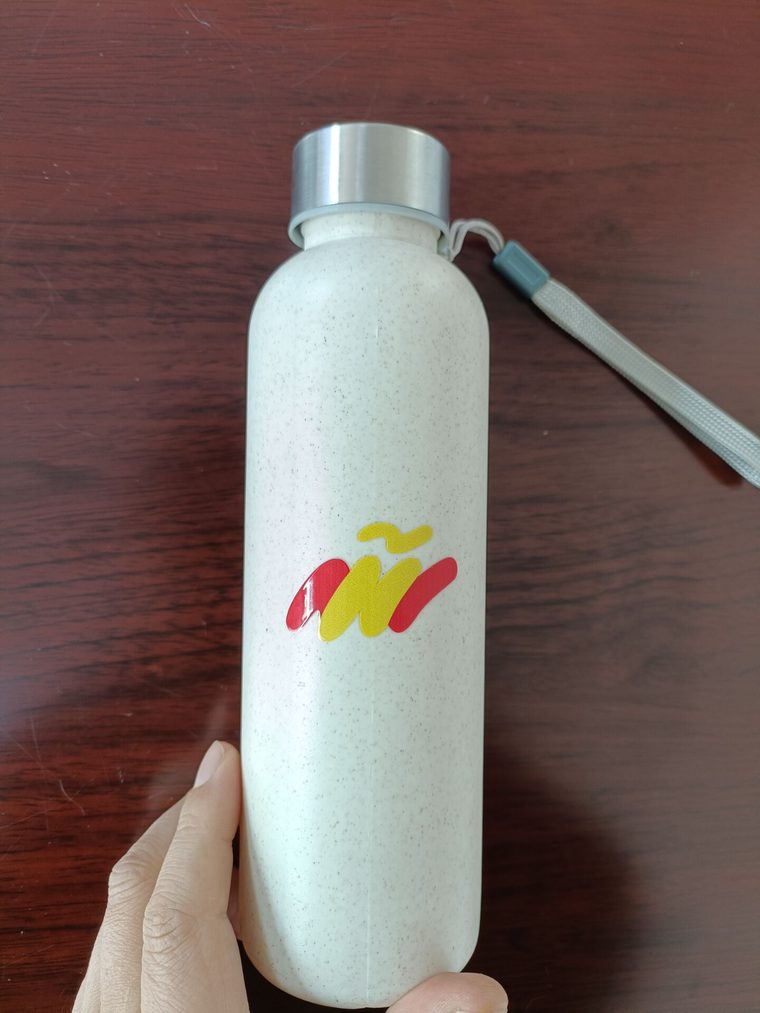 Custom bamboo-fibre water bottle with a crisp printed logo and 304 stainless-steel lid