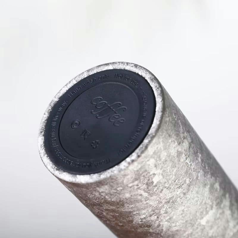 Silver ice-crack texture on a titanium vacuum cup body